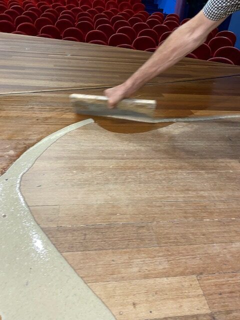 filling seams and at the same time applying oil finish to the wooden floor