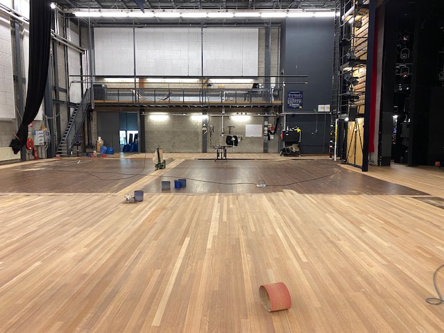 stage floor divided into sanding surfaces