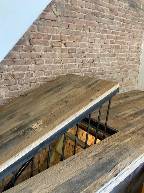 custommade basement hetch covered with barnwood oak floor